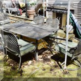 L20. Metal patio table and 6 chairs. 